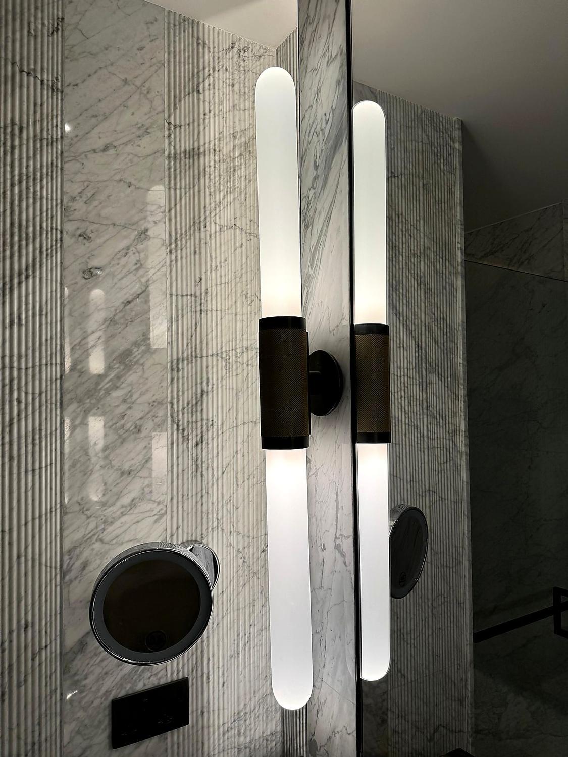 Alabaster sconces on marble
